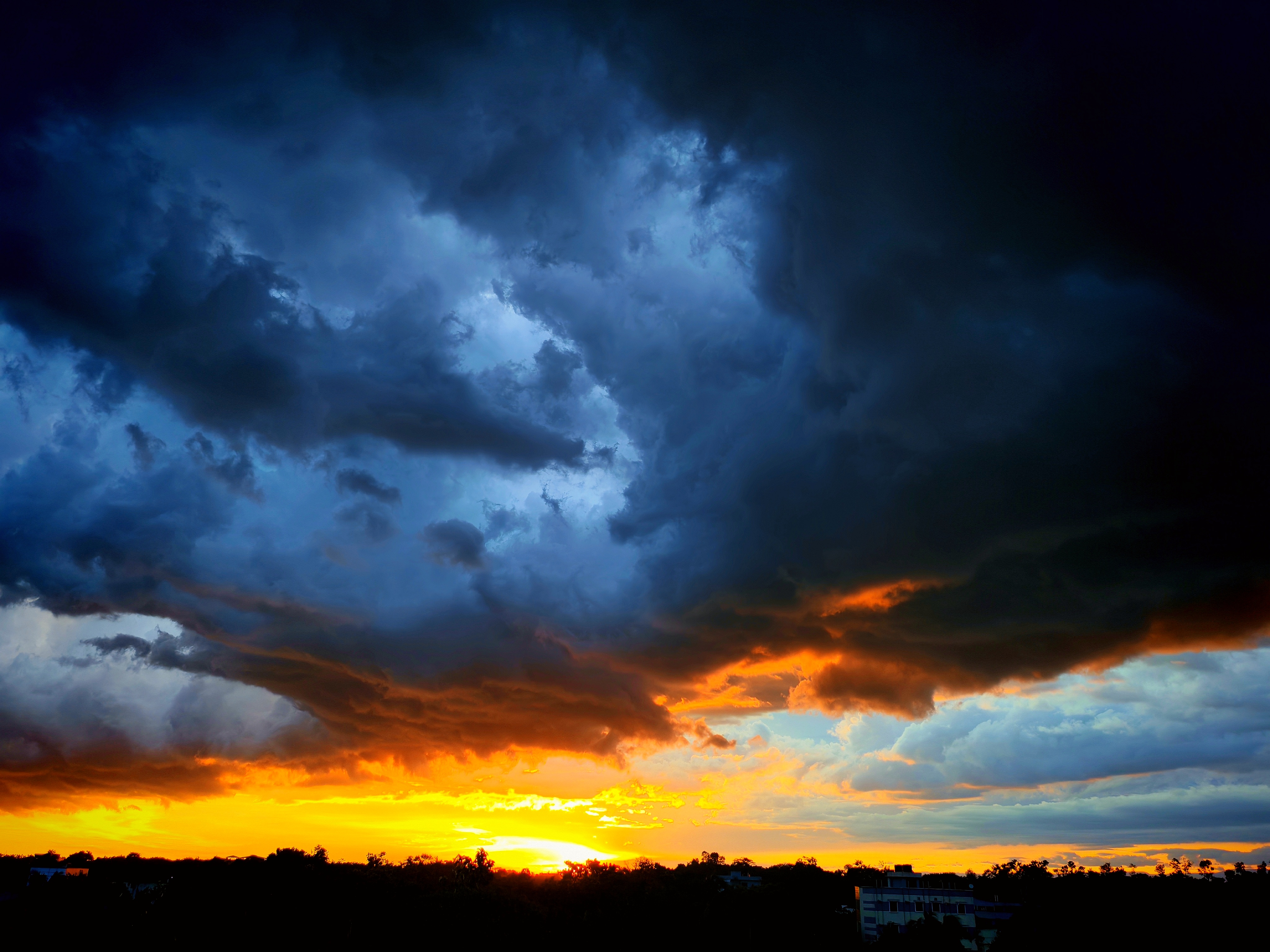 The sky burns before the rain